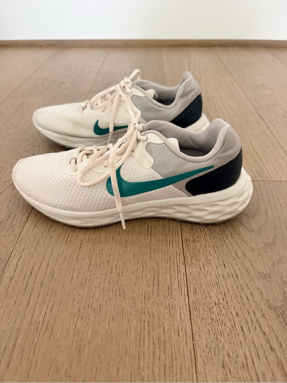 Nike White Sneakers with Teal Swoosh and Black Heel